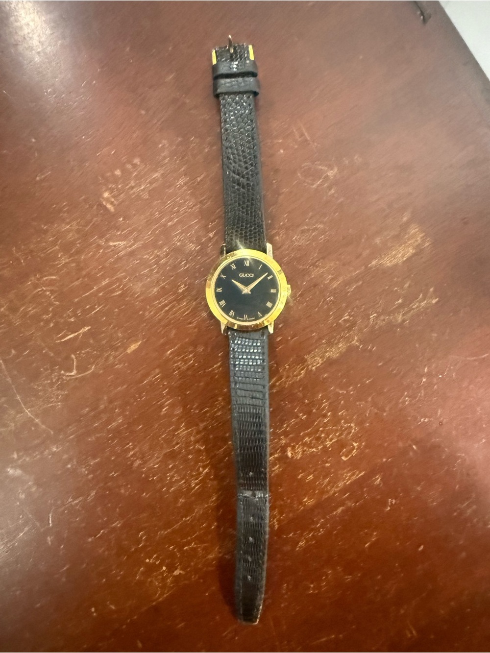 Gucci 2200L Black and Gold Round Leather Strap Watch